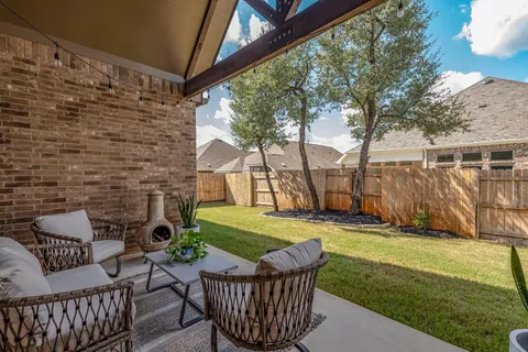 an aerial view of a house with a garden