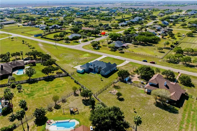a view of a swimming pool with an ocean view
