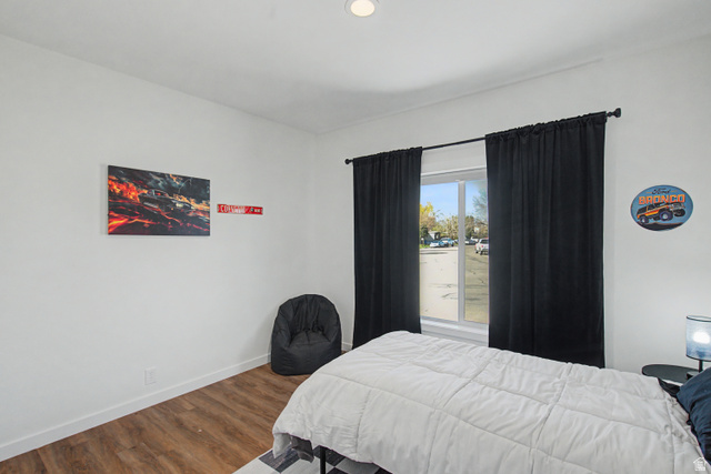 502 West 725 North Logan, UT 84321 - Photo 15 of 25 Bedroom featuring baseboards and dark wood-style floors
