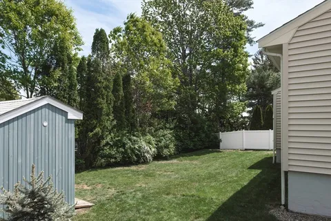 a aerial view of a house with a lake view