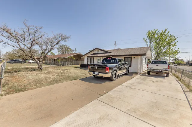 a car parked in front of a house