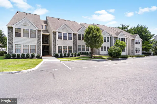 a view of large house with a yard