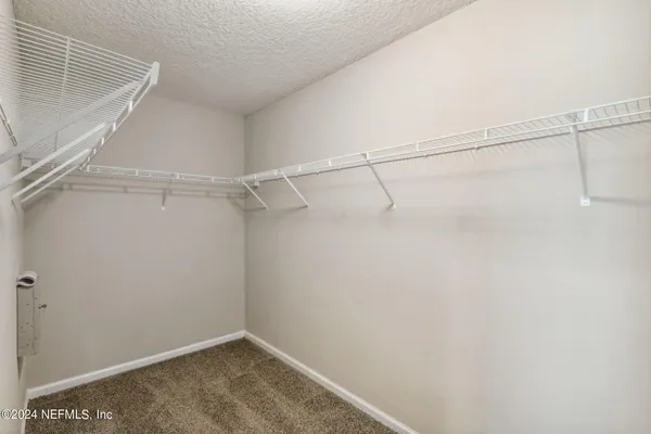 a view of a room with racks on the wall