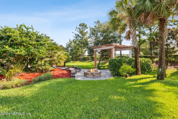 a front view of a house with a yard table and chairs