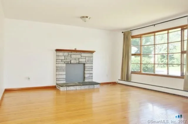 a view of an empty room with a window