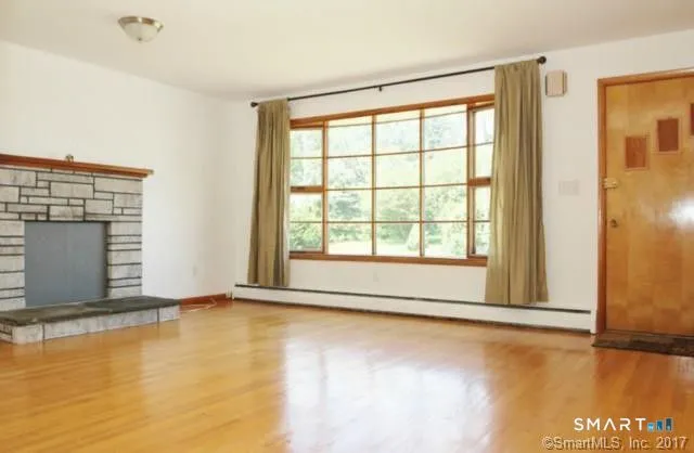 a view of an empty room with glass door