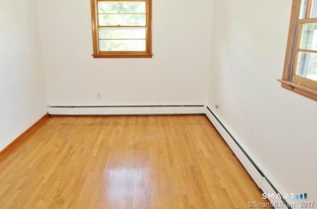 101 Waller Road Bridgeport, CT 06606 - Photo 7 of 10 a view of a room with wooden floor and a window