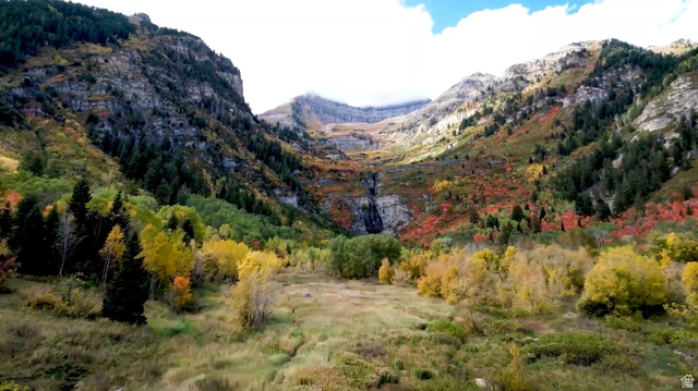 3 Sundance Rec Resort, Unit 3 Provo, UT 84604 - Photo 5 of 30 Natural mountain landscape featuring a waterfall, diverse tree foliage, and an expansive grassy terrain