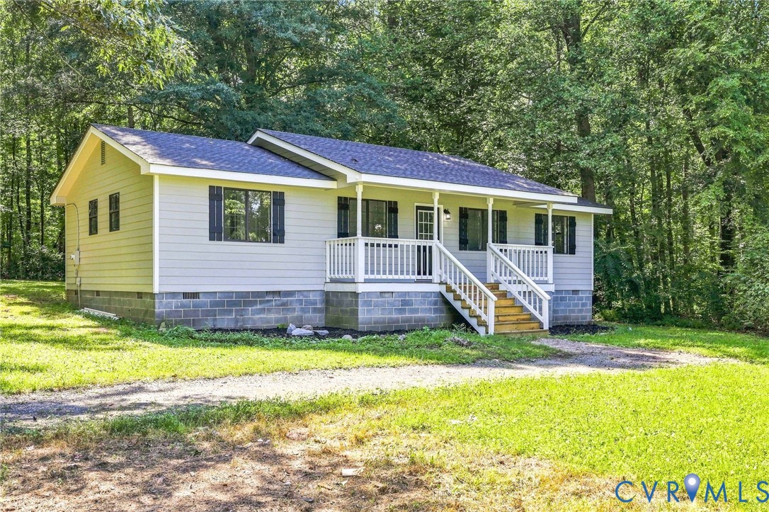 85 Columbia Road Cartersville, VA 23027 - Photo 1 of 26 Light-colored siding exterior with a dark shingle