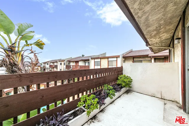 a view of a wooden fence and a bench