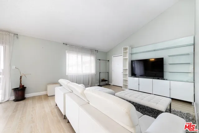 a hotel room with bed and a flat screen tv