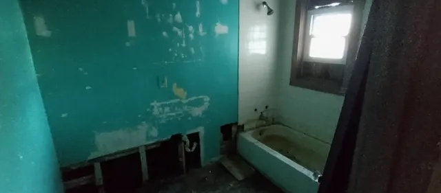 a front view of a house with many windows