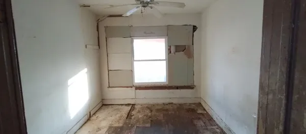 a view of an empty room and window