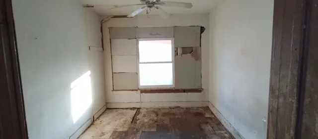 a view of an empty room and window