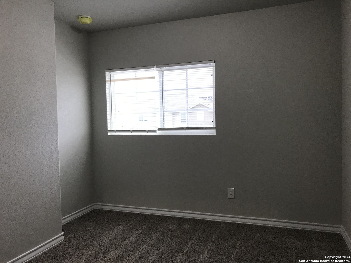 16905 Spirit Brook, Unit 2 Selma, TX 78154 - Photo 11 of 15 an empty room with a window