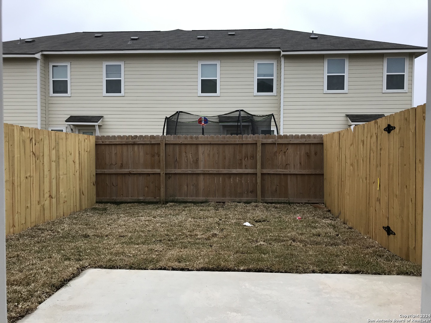 16905 Spirit Brook, Unit 2 Selma, TX 78154 - Photo 15 of 15 a view of a house with a backyard