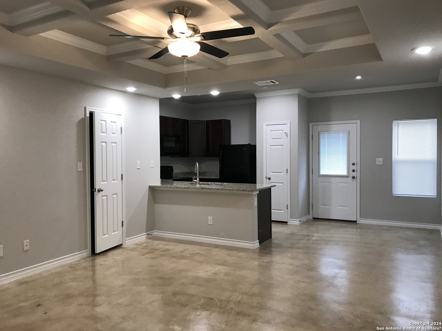 16905 Spirit Brook, Unit 2 Selma, TX 78154 - Photo 2 of 15 a view of a livingroom with kitchen and a window