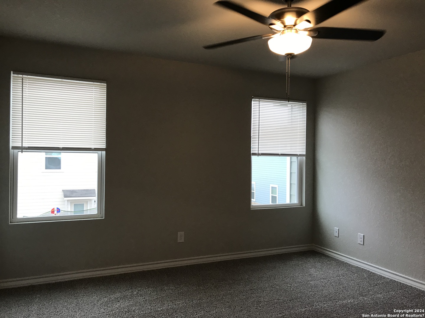 16905 Spirit Brook, Unit 2 Selma, TX 78154 - Photo 6 of 15 a view of an empty room with a window