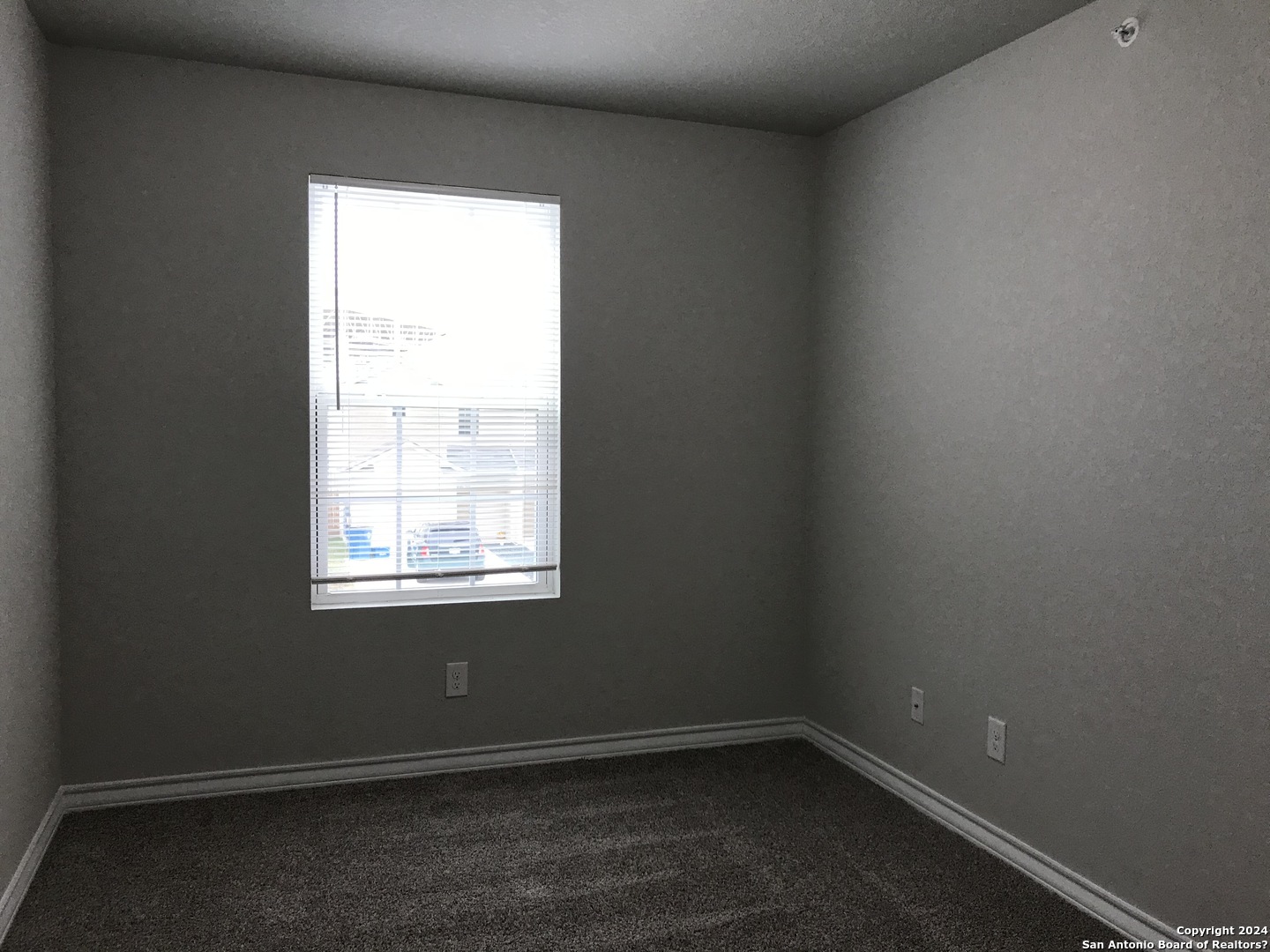 16905 Spirit Brook, Unit 2 Selma, TX 78154 - Photo 10 of 15 an empty room with a window