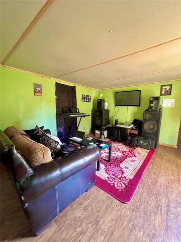 a room with furniture and a flat screen tv