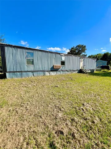 a view of a backyard with a small house
