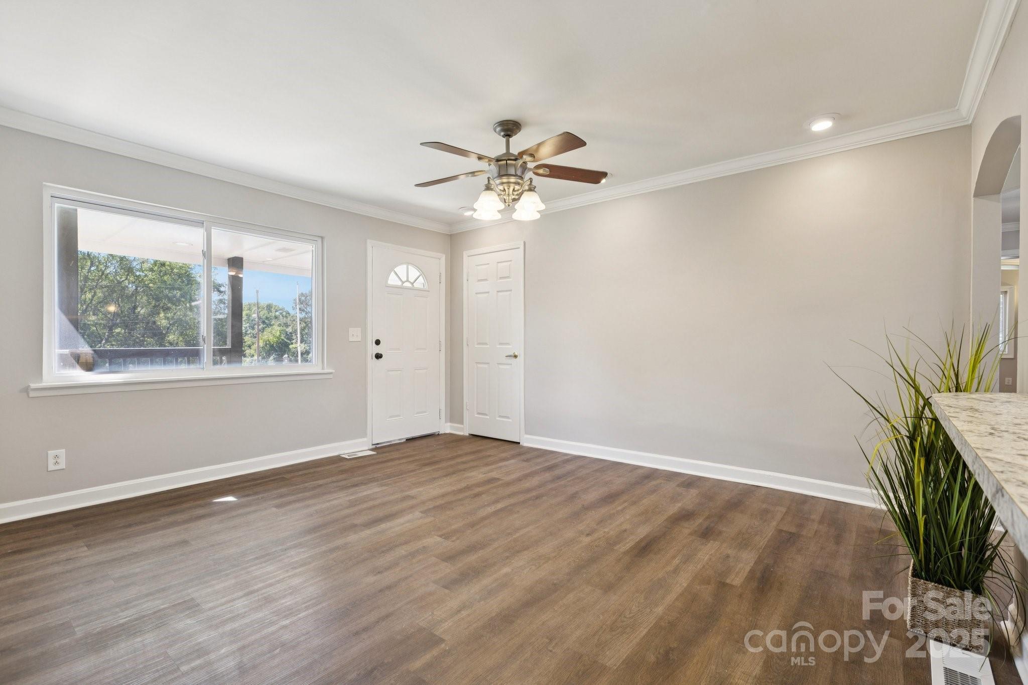 1024 Old Mountain View Road Mount Holly, NC 28120 - Photo 12 of 41 wooden floor in an empty room with a window