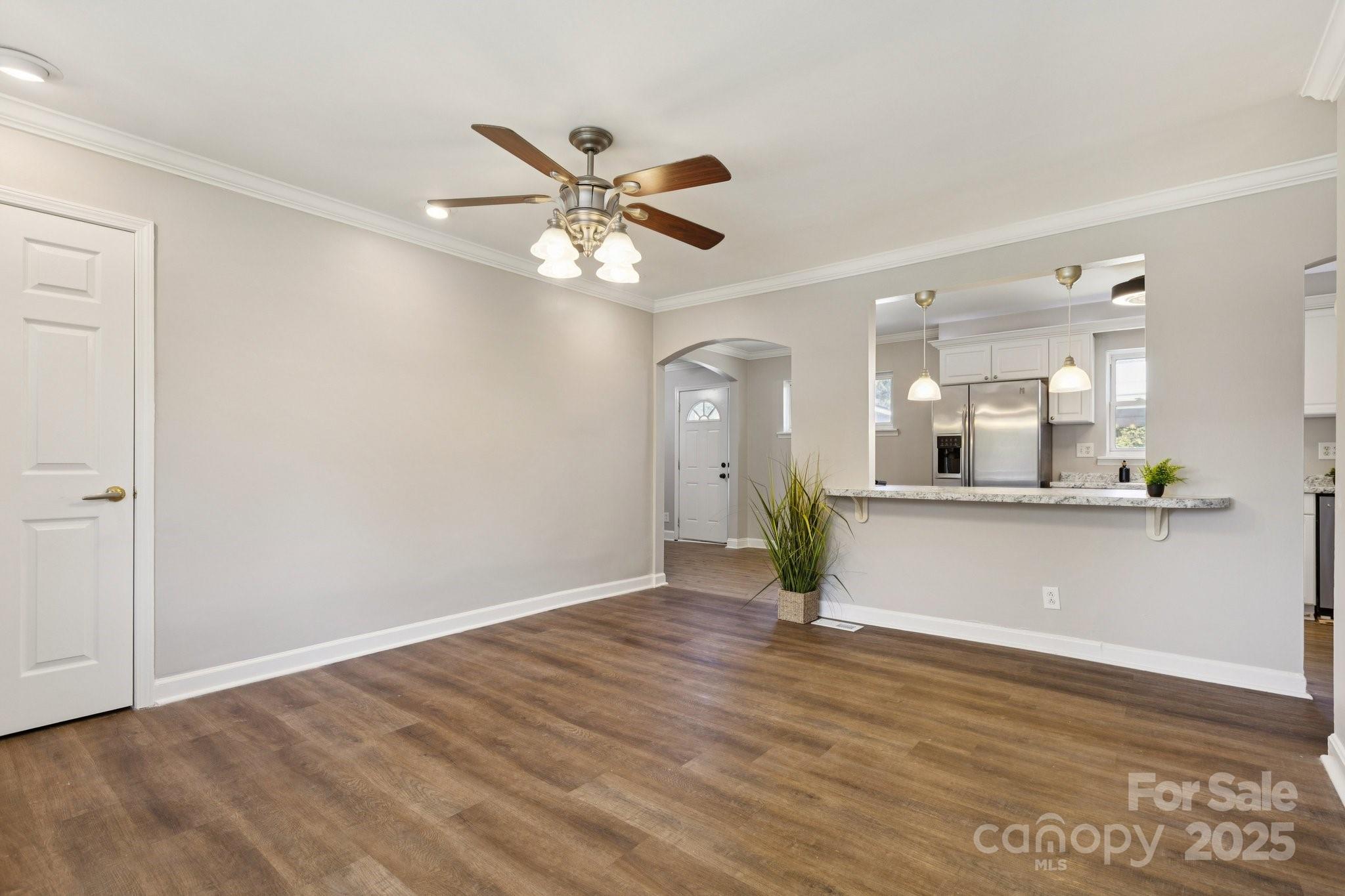 1024 Old Mountain View Road Mount Holly, NC 28120 - Photo 13 of 41 a view of an empty room with window and wooden floor