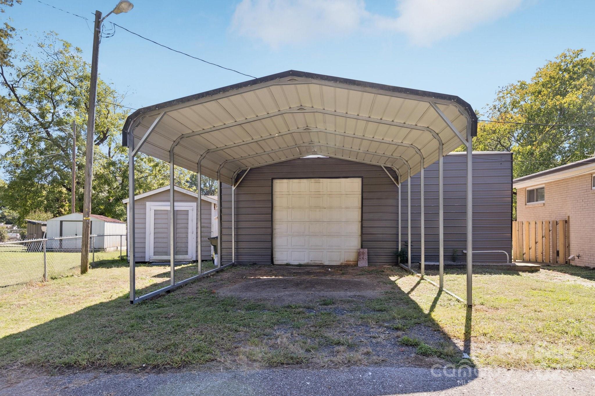 1024 Old Mountain View Road Mount Holly, NC 28120 - Photo 20 of 41 a front view of a house with a garden