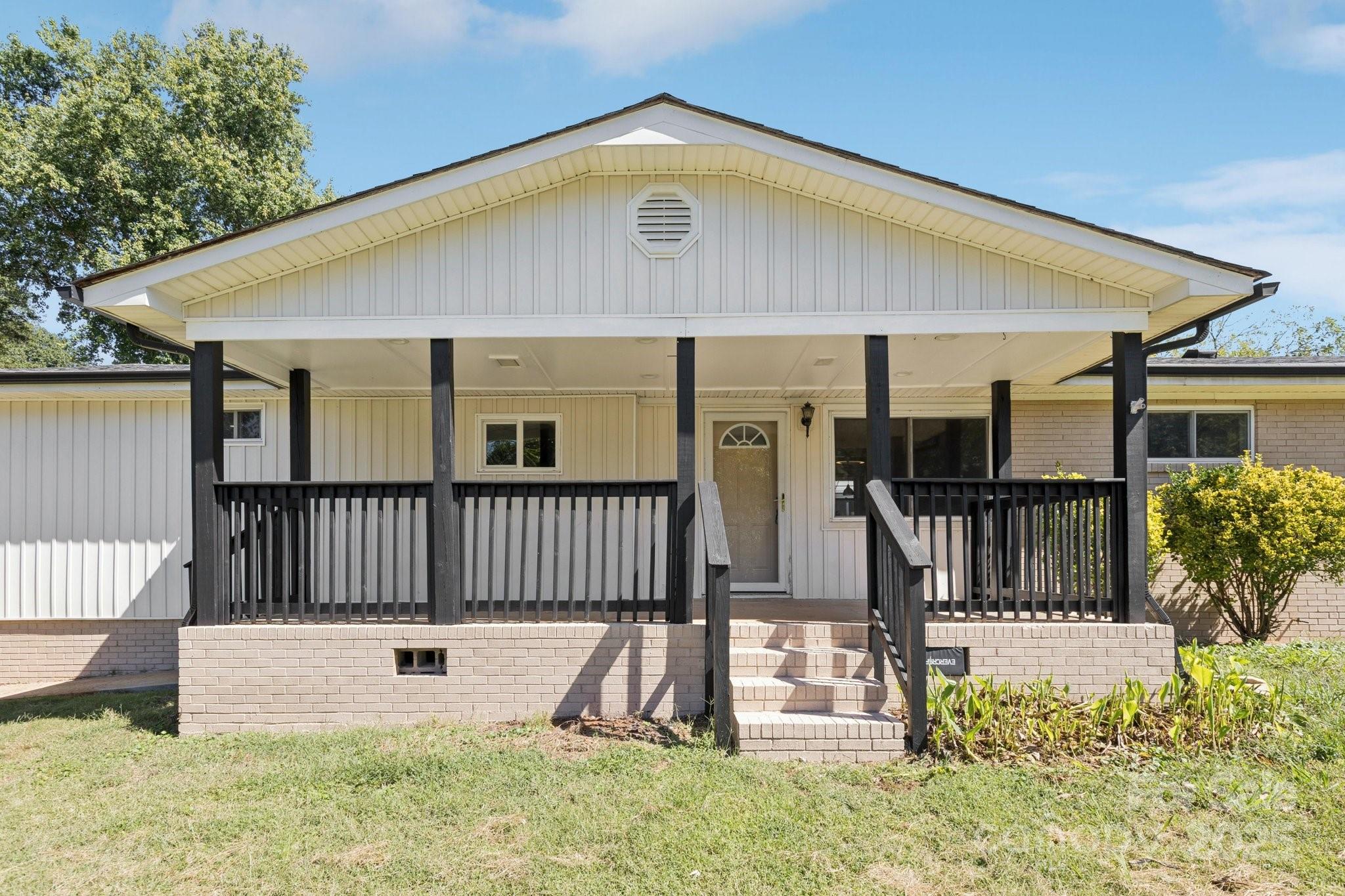 1024 Old Mountain View Road Mount Holly, NC 28120 - Photo 2 of 41 a view of a house with wooden fence and a porch