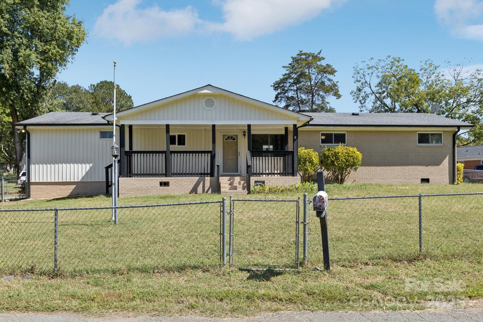 1024 Old Mountain View Road Mount Holly, NC 28120 - Photo 3 of 41 a front view of a house with garden