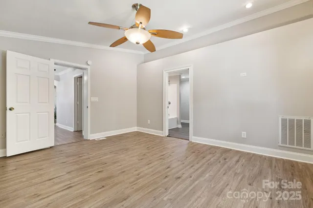 a bathroom with a double vanity sink mirror and bathtub
