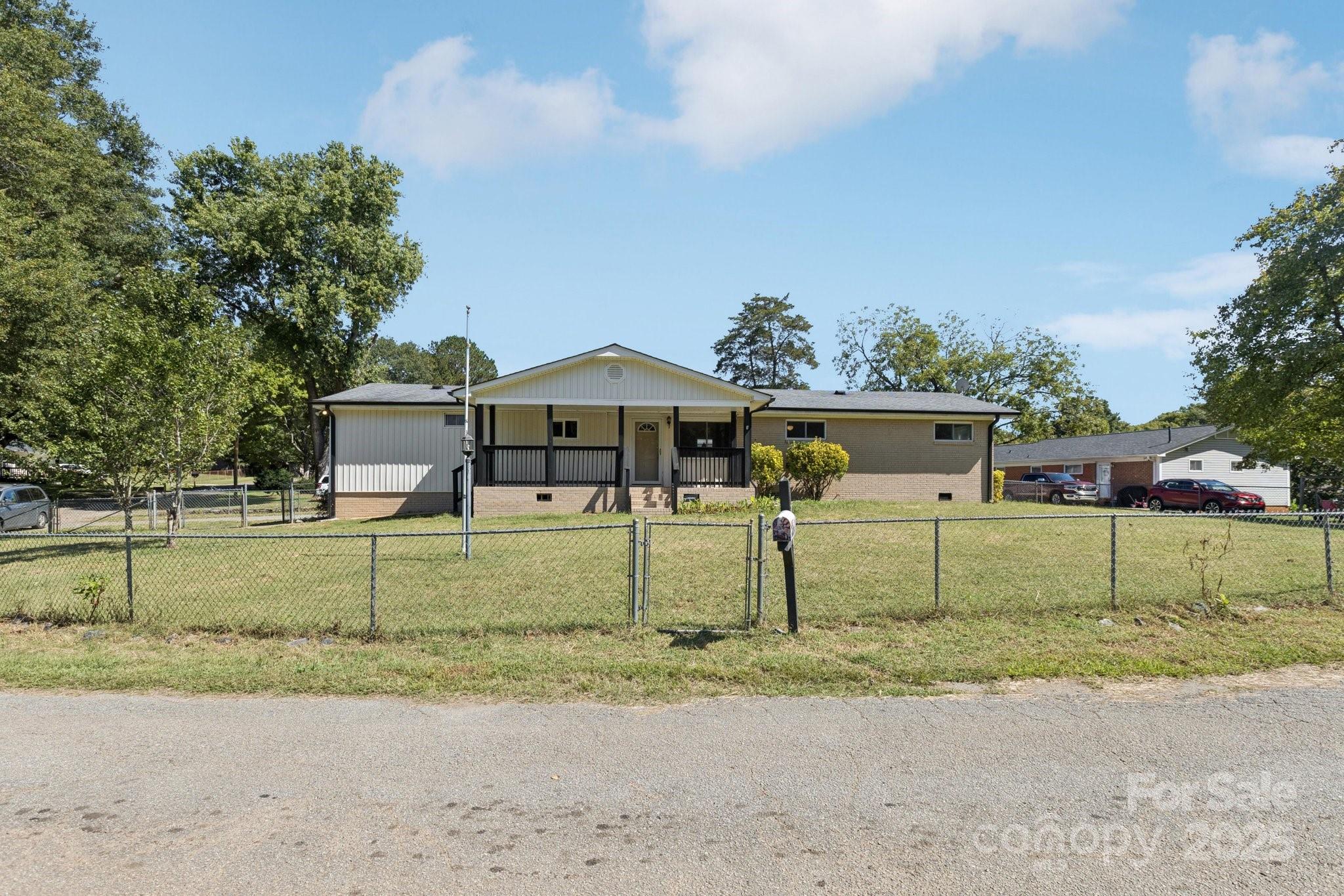 1024 Old Mountain View Road Mount Holly, NC 28120 - Photo 4 of 41 front view of a house with a yard