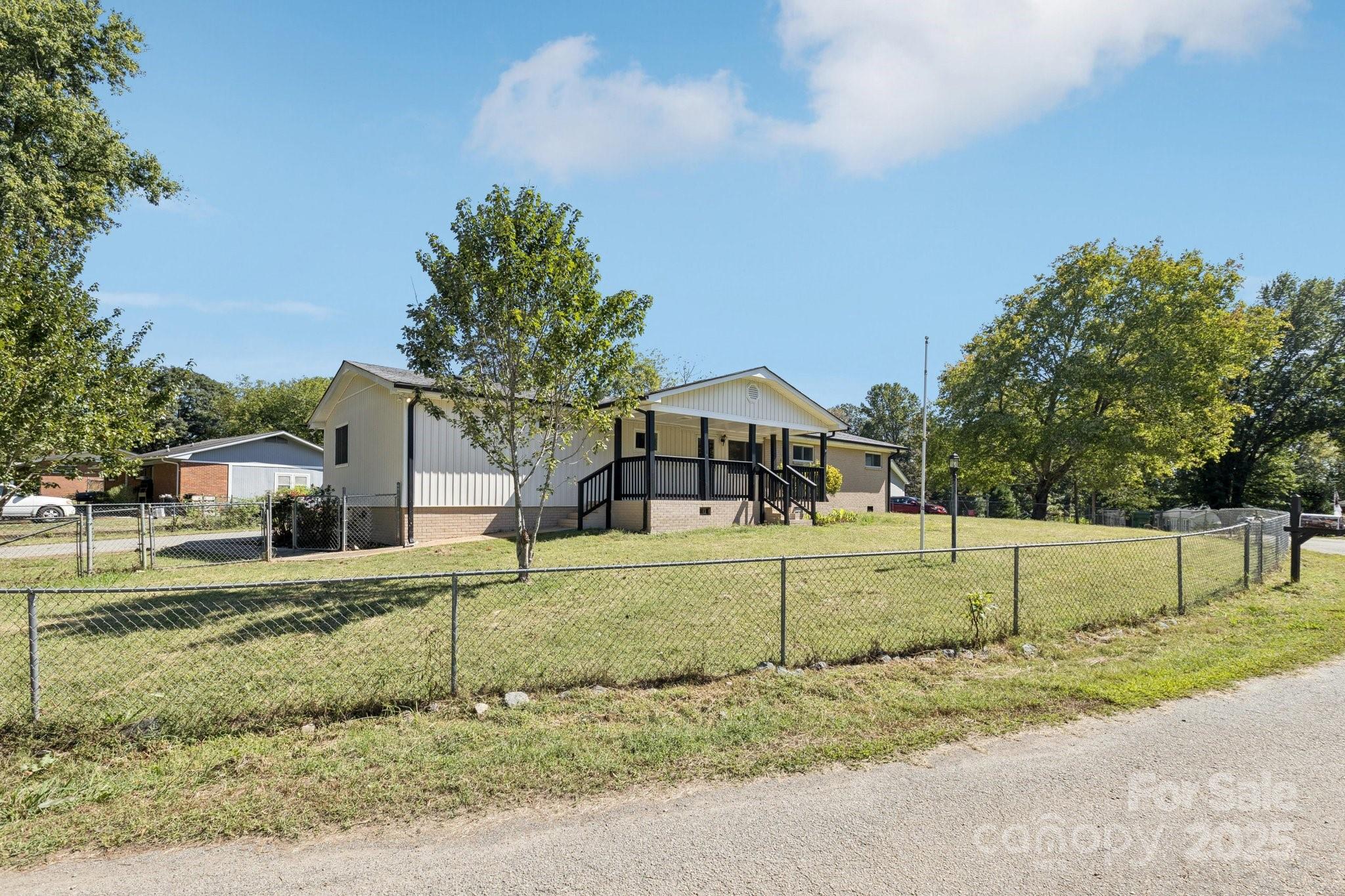 1024 Old Mountain View Road Mount Holly, NC 28120 - Photo 6 of 41 a front view of a house with a yard