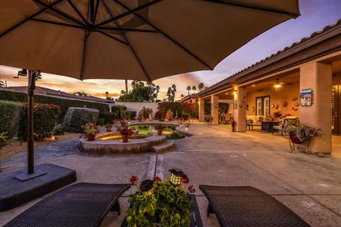 a view of a swimming pool with a patio