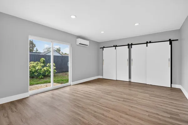 a view of entryway with wooden floor
