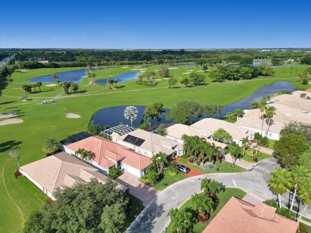 a view of a street with a garden