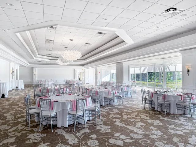 a view of a swimming pool and outdoor seating