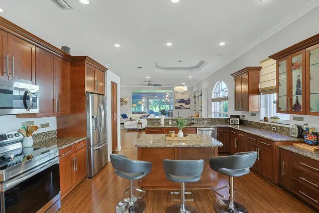 a large kitchen with a table and chairs