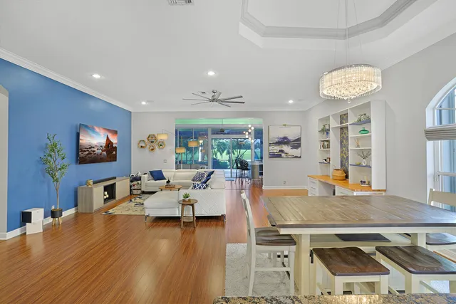 a living room with fireplace furniture and a flat screen tv