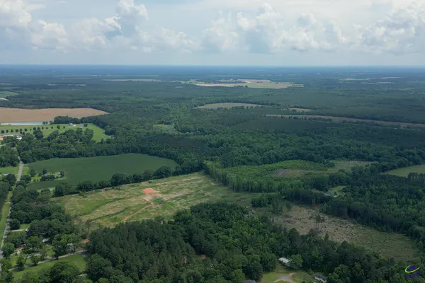 a view of a field with an ocean