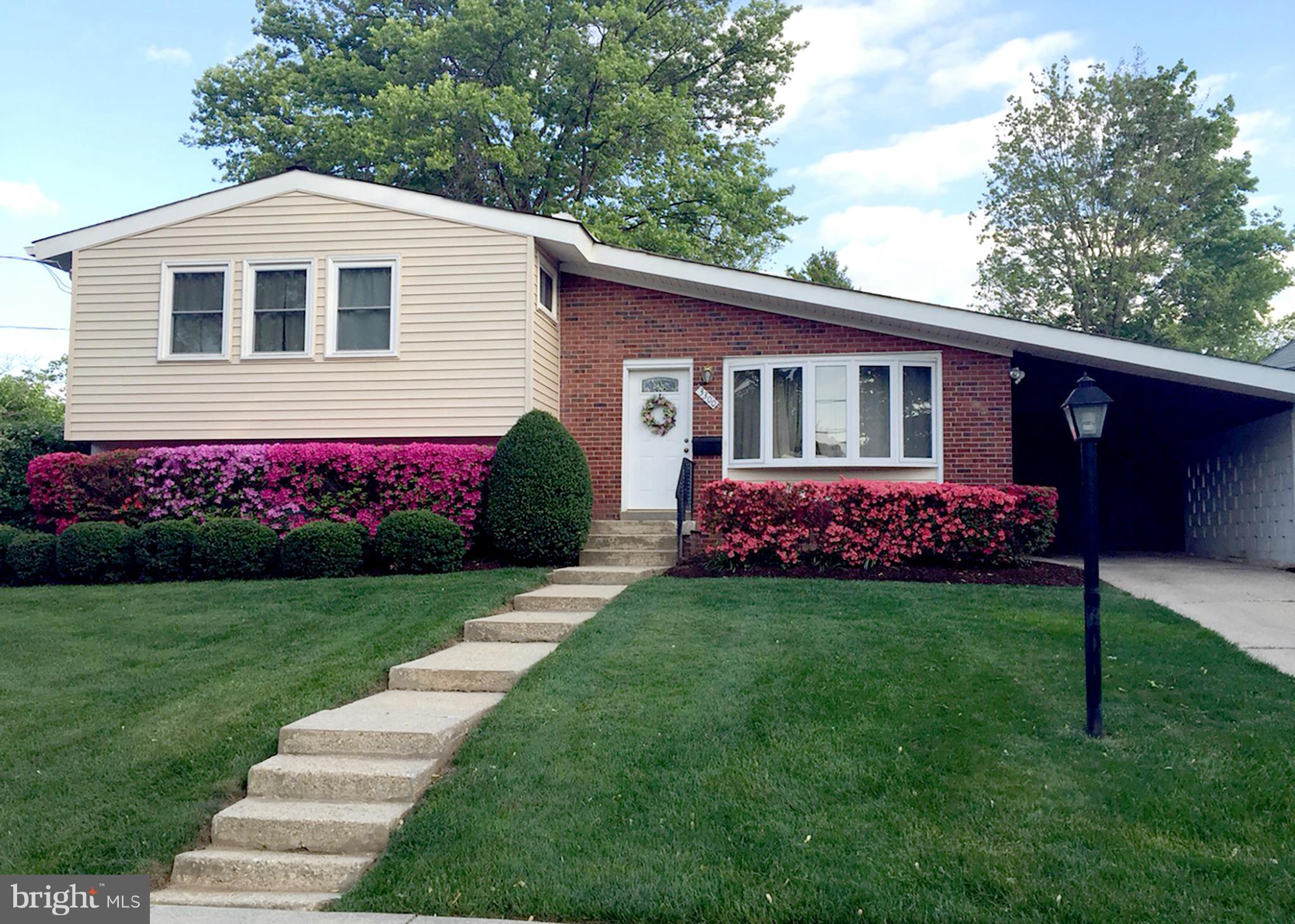 3300 Kayson Street Silver Spring, MD 20906 - Photo 3 of 27 a front view of a house with a garden