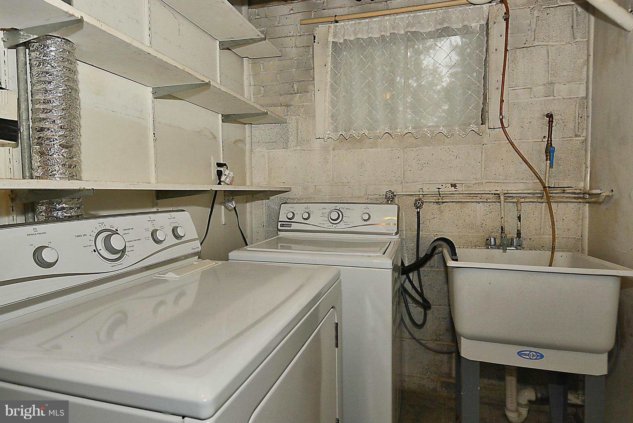 3300 Kayson Street Silver Spring, MD 20906 - Photo 22 of 27 a utility room with dryer and washer