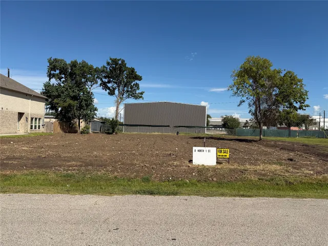 a view of a street with a building in the background
