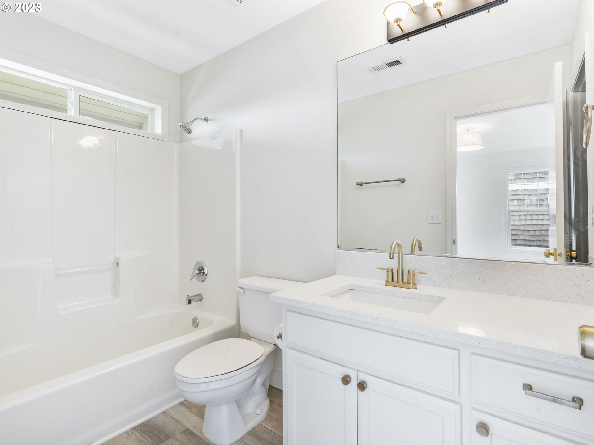 940 Necanicum Drive Seaside, OR 97138 - Photo 12 of 23 a bathroom with a sink toilet and shower