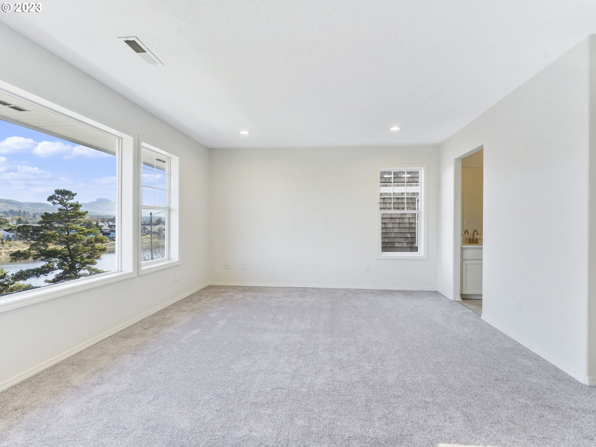 940 Necanicum Drive Seaside, OR 97138 - Photo 14 of 23 a view of an empty room with a window
