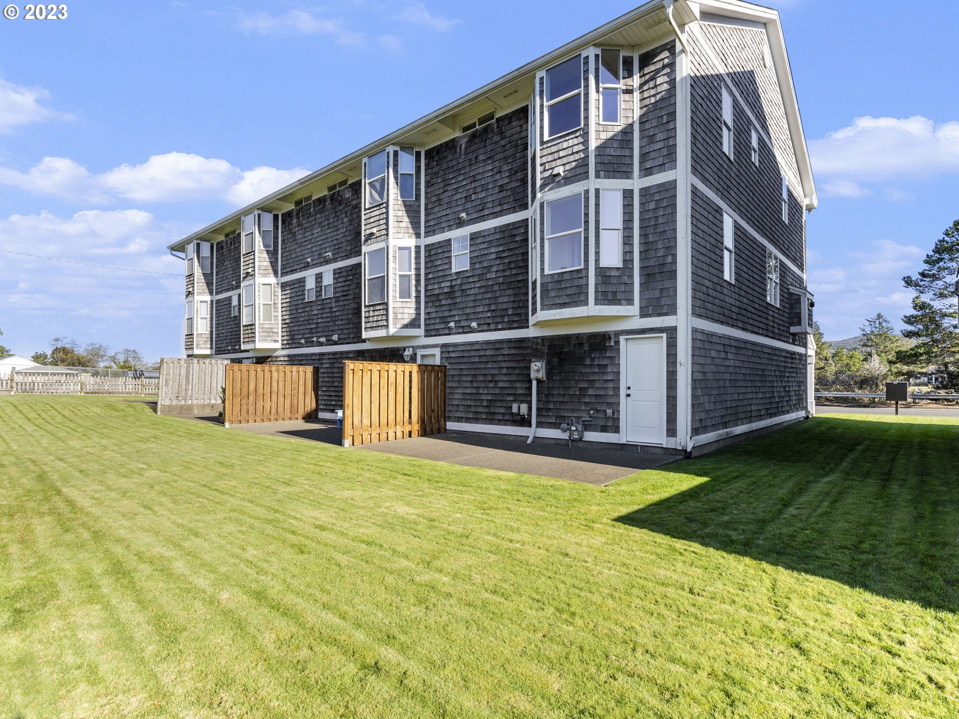 940 Necanicum Drive Seaside, OR 97138 - Photo 16 of 23 a view of building with yard in front of it