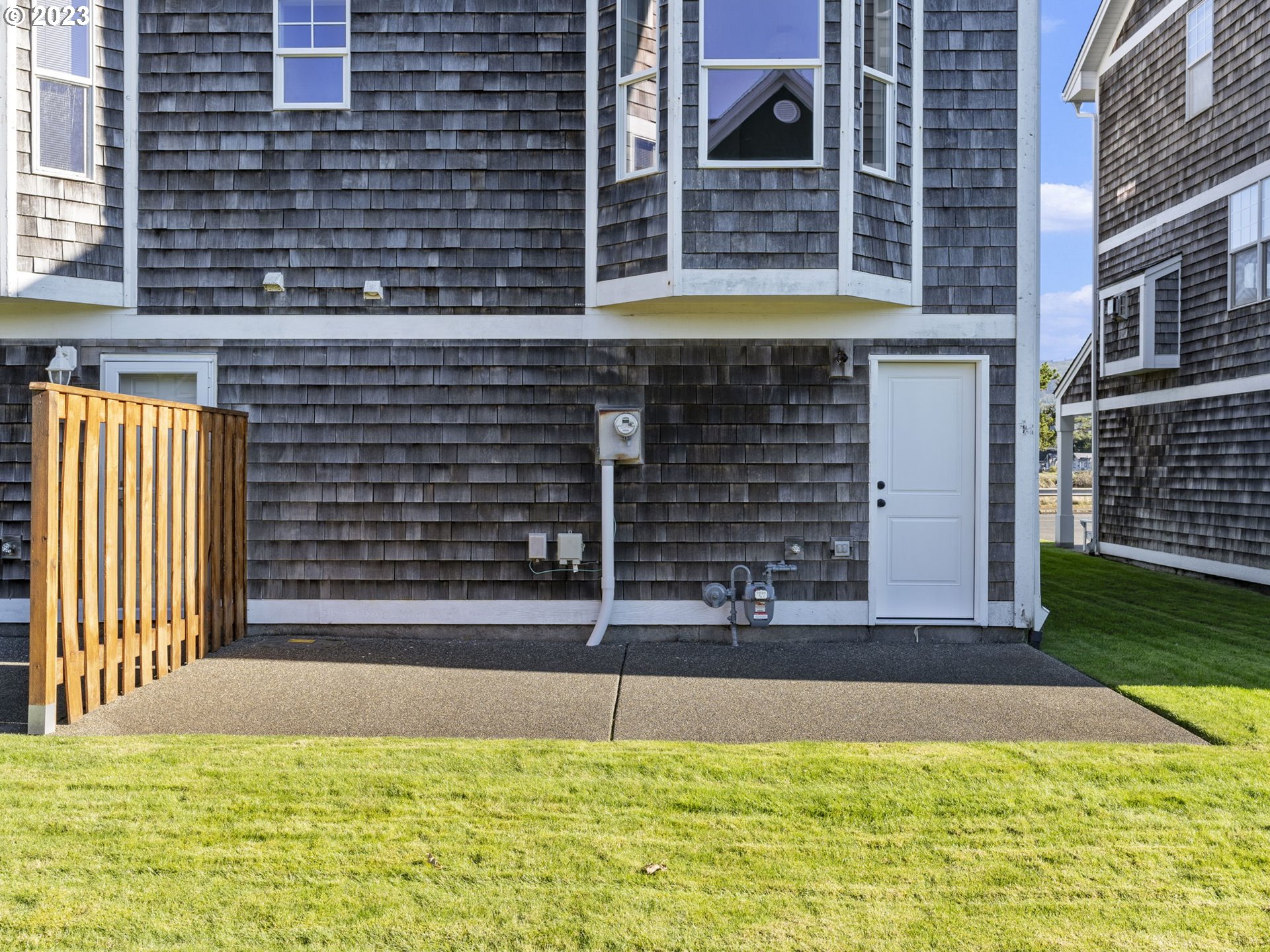 940 Necanicum Drive Seaside, OR 97138 - Photo 17 of 23 a view of front door of house with a yard