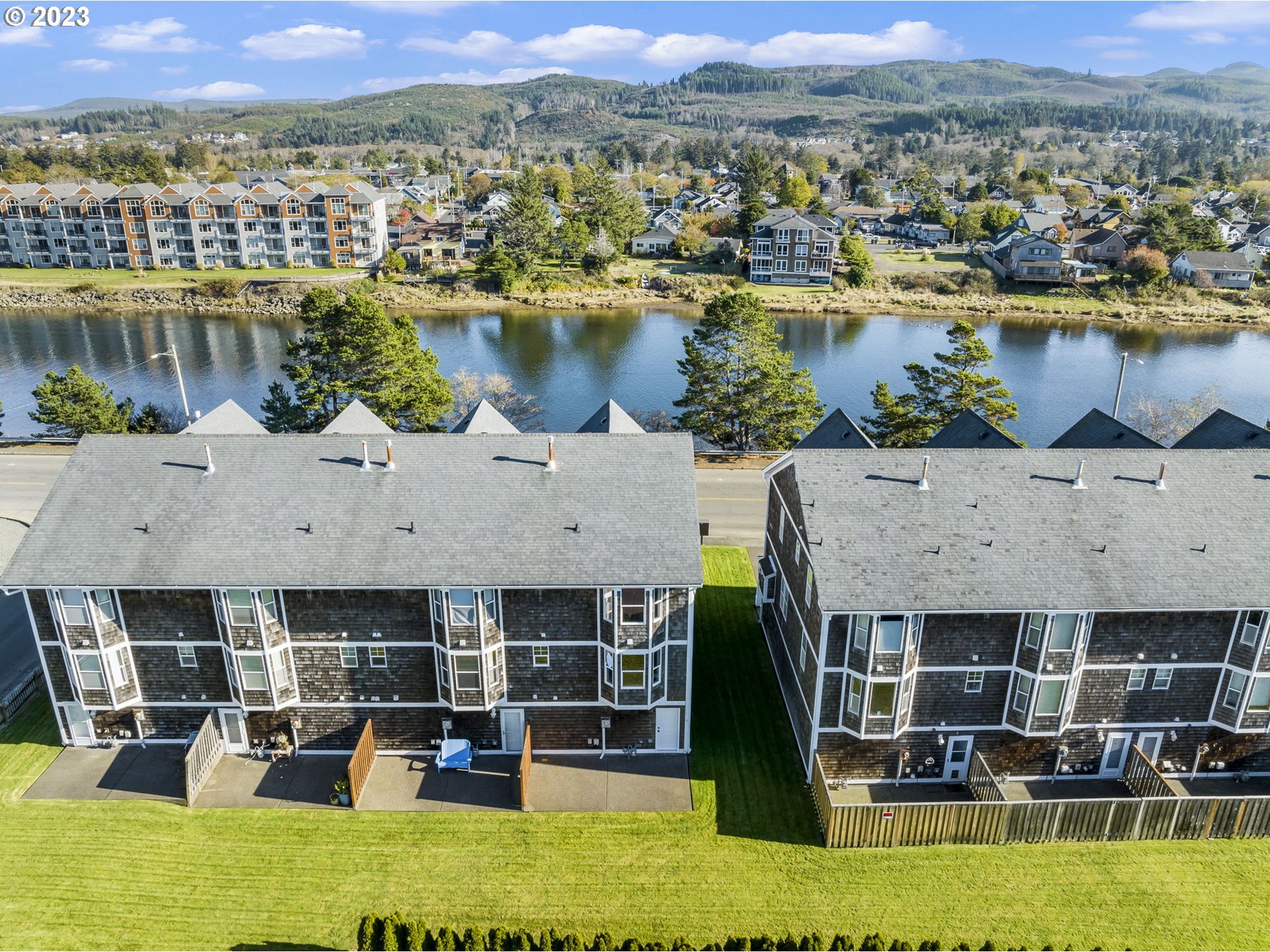 940 Necanicum Drive Seaside, OR 97138 - Photo 20 of 23 a view of a lake with a mountain in the background