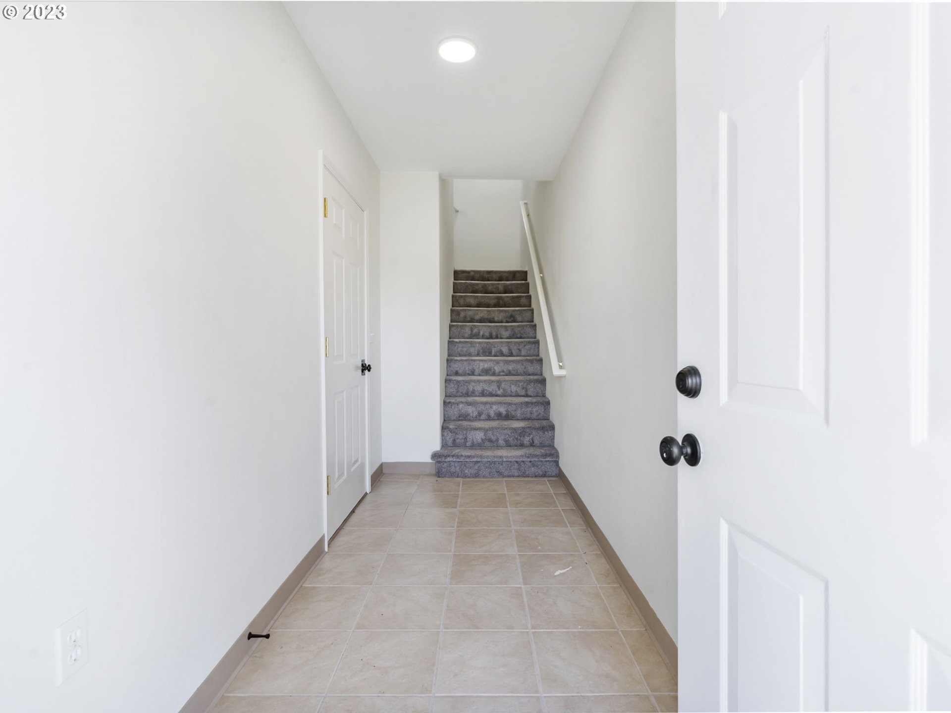 940 Necanicum Drive Seaside, OR 97138 - Photo 3 of 23 a view of a hallway with stairs