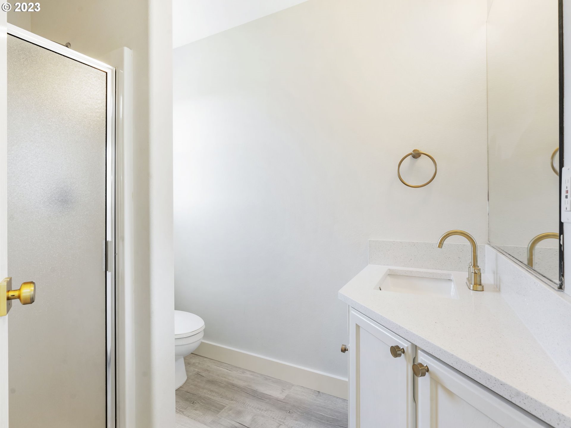 940 Necanicum Drive Seaside, OR 97138 - Photo 9 of 23 a bathroom with a toilet sink and mirror